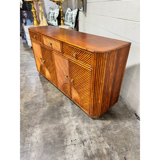 These don’t come around often! Amazing thick pencil reed style bamboo credenza with tons of storage. Solid condition....