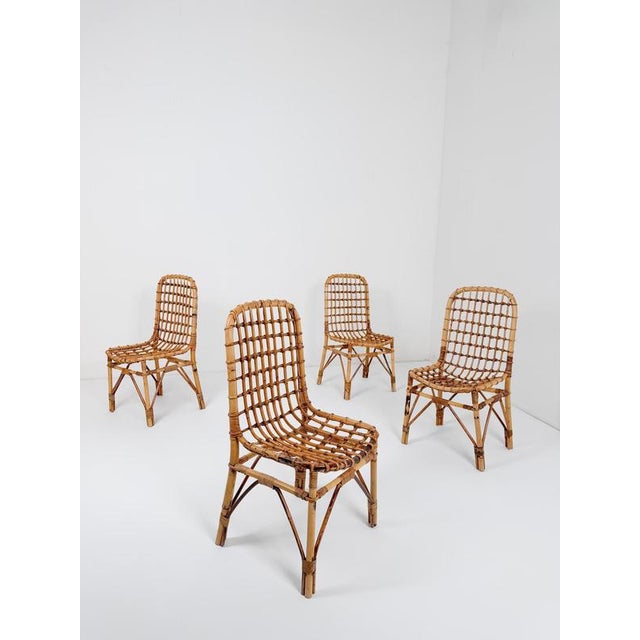We are pleased to offer this exceptional set of four Italian Mid-Century Modern dining chairs, handcrafted in Italy circa...