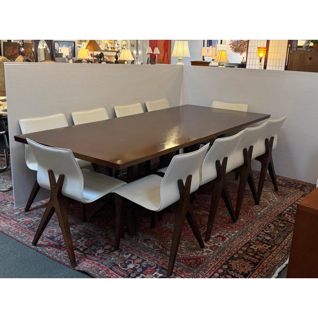 Design Plus Gallery presents a Sculpted Trestle Couture Dining Table by Joseph Jeup and a Set of Ten X-Back Modern Dining...