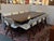 Design Plus Gallery presents a Sculpted Trestle Couture Dining Table by Joseph Jeup and a Set of Ten X-Back Modern Dining...