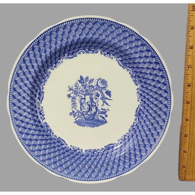This stunning collectable plate from Spode, made in England, features a beautiful neoclassical design with a blue and...