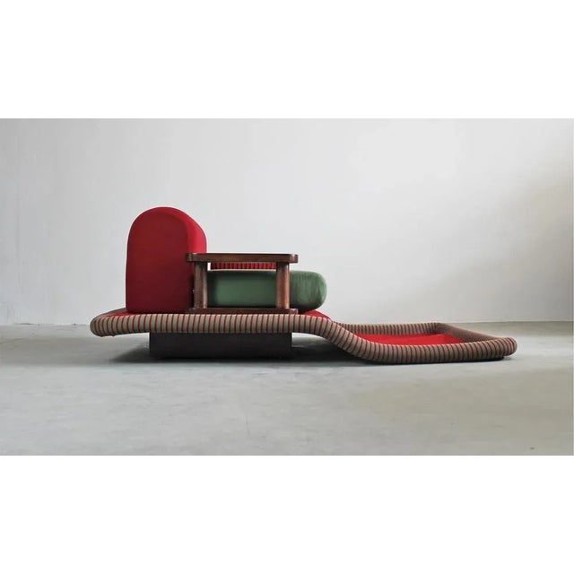 The Flying Carpet or Tappeto Volante armchair is an iconic seat with a base and an armrest in beech wood, the seat, and...