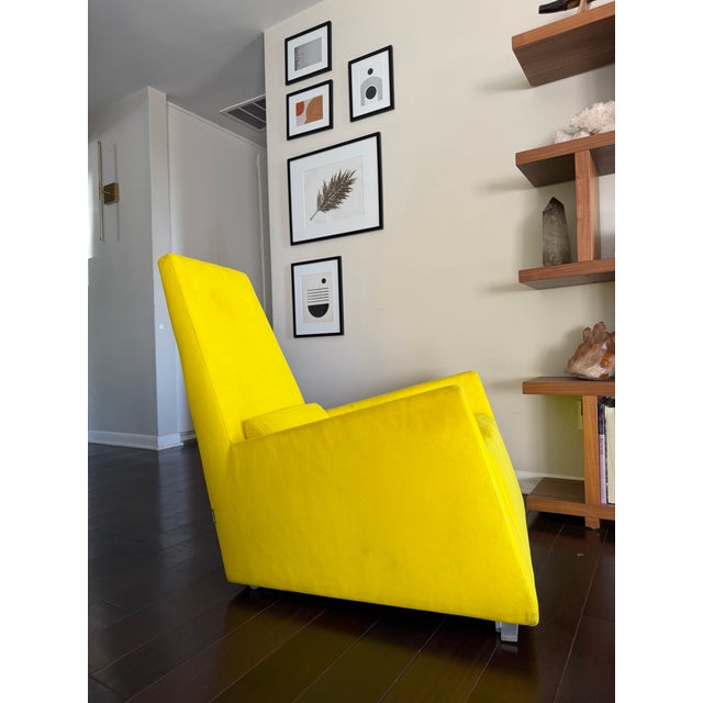 French modern lounge chair by Ligne Roset, made in France. The chair features a sculptural, angular silhouette with wide...