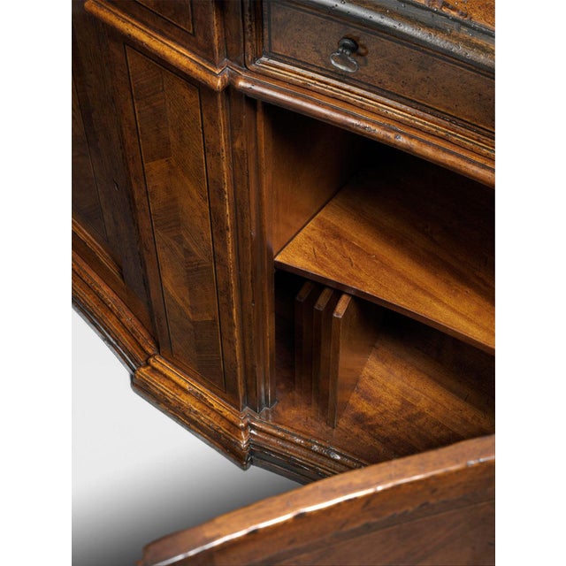 Handcrafted in Italy, this sideboard features concave-shaped doors decorated with a herringbone pattern of cherry and...