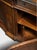 Handcrafted in Italy, this sideboard features concave-shaped doors decorated with a herringbone pattern of cherry and...