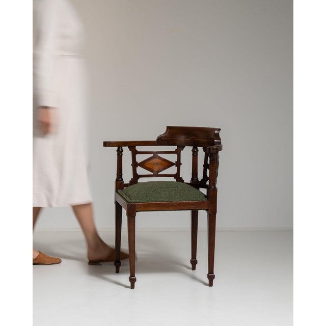 Here is a side chair, its dark mahogany, spindle back, olive upholstered seat the first thing to catch the eye. It was...