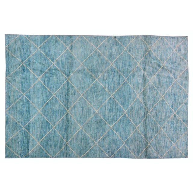 Hand-knotted with care using traditional rug-making techniques, this wool rug blends timeless craftsmanship with a modern...