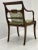 Beautiful Mahogany finish side chairs with hand carved details, saber back legs, curved armrest, and cresting top rail.