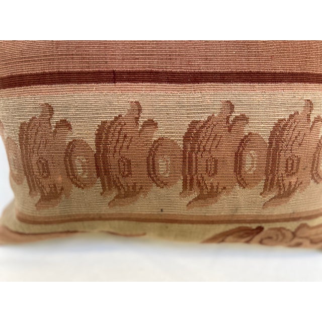 Decorative pillow upholstered in richly woven 19th century Aubusson tapestry, adorned with an elegant motif. A beautiful...