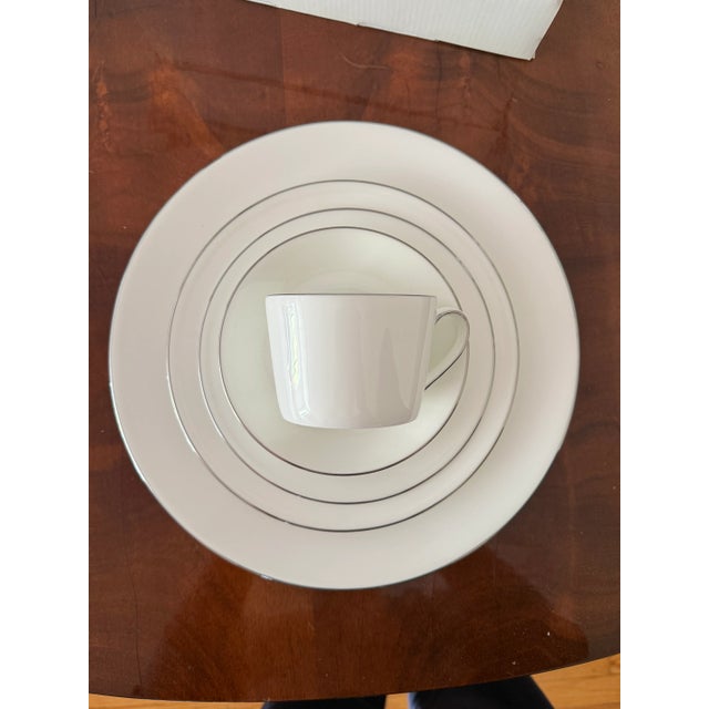 This is a set of 10 factory new 5-piece place settings in the 'Signature Platinum' pattern by Royal Doulton. The Royal...