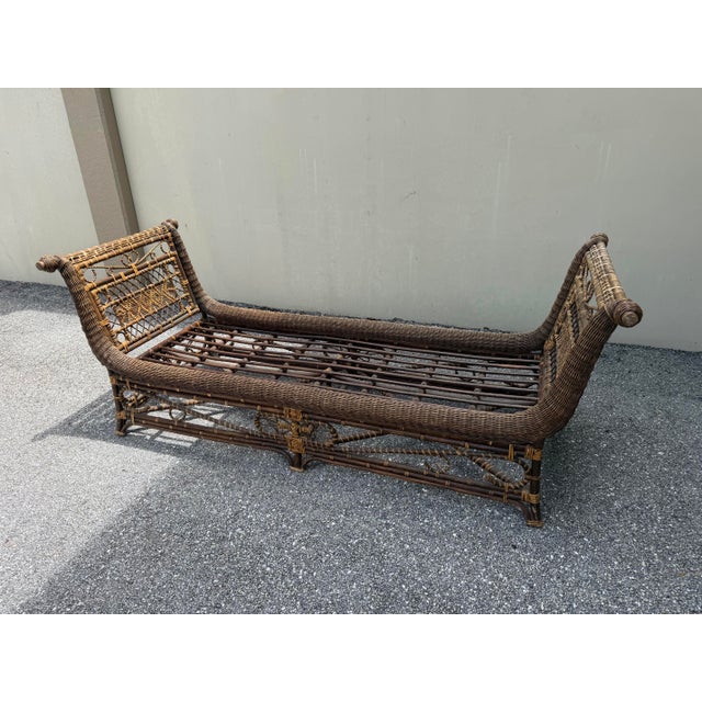Midcentury modern rattan and wood daybed attributed style of Franco Albini. The curved arms and caning are often seen in...