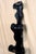 Handmade folk art black painted scroll shelf that stands in the corner. Stands tall and thin with a distinct silhouette. 5...