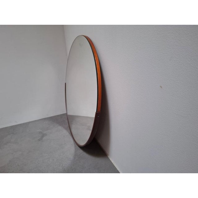 Vintage Round Wall Mirror, Czechoslovakia, circa 1970 An understated round wall mirror dating from the 1970s, featuring a...