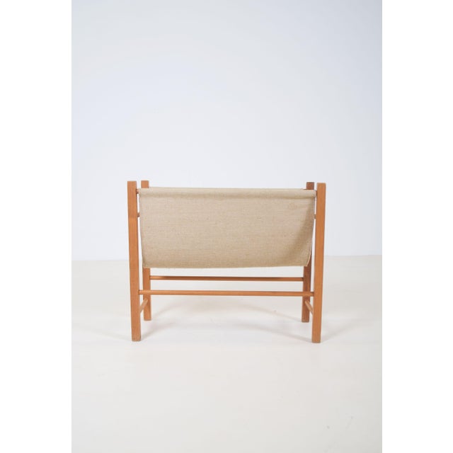 Danish magazine holder manufactured by PBJ Mobler in the 1960s. The minimalist design combines solid pine wood with a...