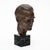 Vintage bust from France made of bronze and supported by a marble base. This piece features the likeness of a man. It...