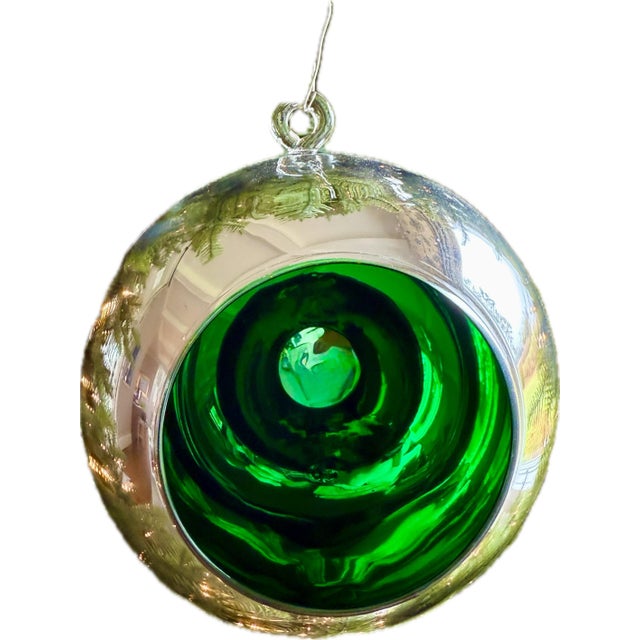 Striking pair of oversized blown-glass ornaments by Two’s Company, each measuring an impressive 14 inches in diameter....