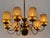 Extremely rare, elegant and highly decorative mid-century modern eight-armed brass chandelier or pendant lamp. Designed...