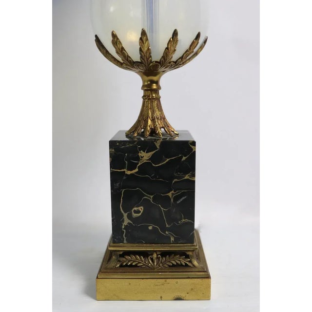 Sophisticated and chic table lamp by Westwood Lamps having an opaline glass body on a bold black marble base, with...