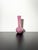 A tall stemmed bud vase, handcrafted in the late 1980s by Mdina Glass, Malta. Crafted from pink opaque glass perfectly...