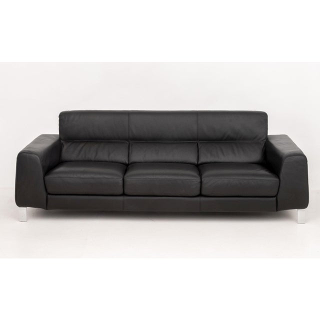 Nicoletti "Simon" Black Leather Three-Seat Sofa, with four chrome-plated legs, marked to the short side. 30.75" H x 89.5"...