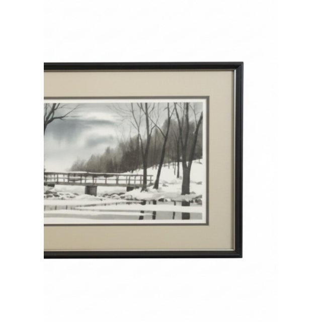 A striking vintage winter landscape print by Tony Graham, dated 1983, presented in its wide panoramic frame and matting....