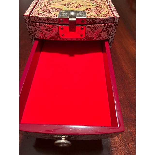 This is a beautifully crafted, ornate jewelry or keepsake box with a strong traditional East Asian aesthetic. The entire...