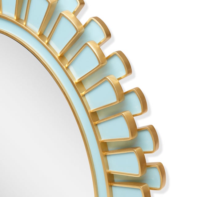 Inspired by the work of revered artist Line Vautrin, radiating petals of icy blue lacquer set against antiqued gold...