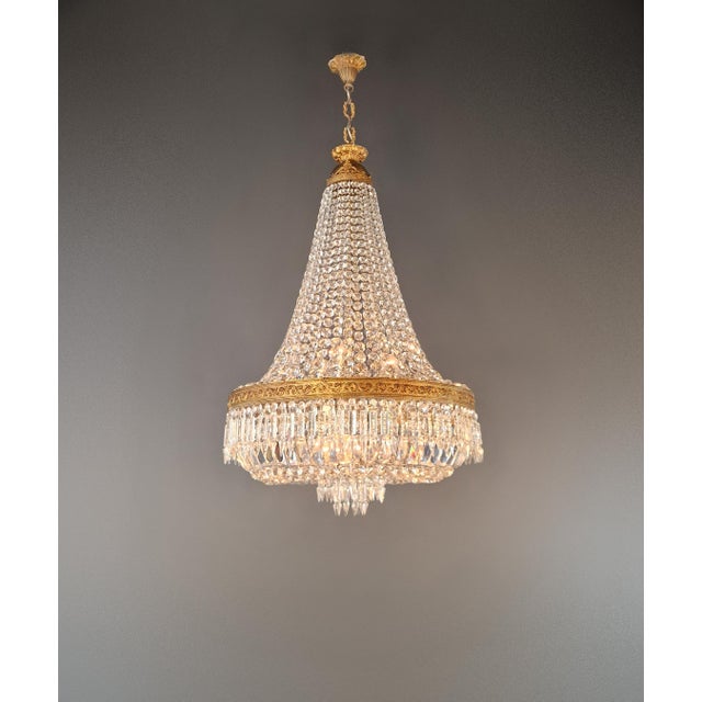 We present to you an exquisite Baroque brass chandelier, a true rarity and an antique gem. This chandelier has been...
