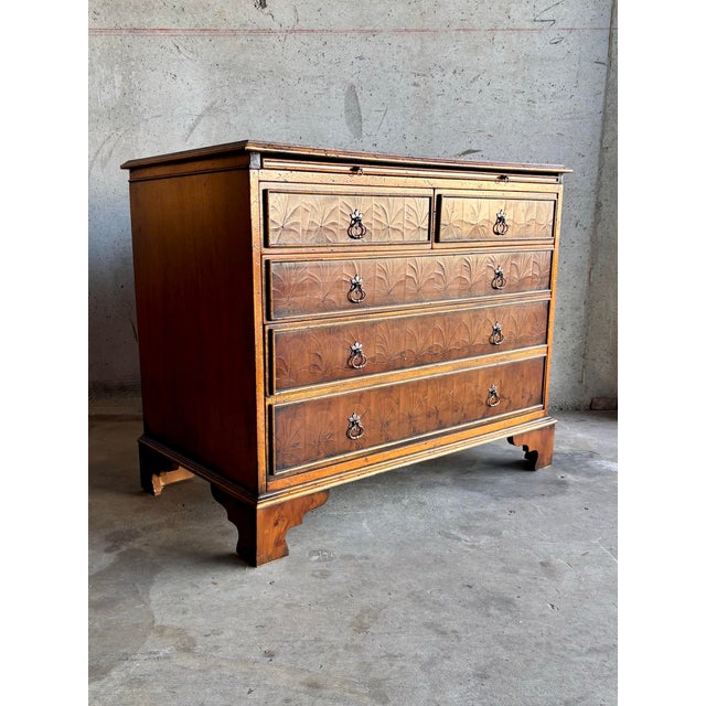 This Chippendale-style chest of drawers, made in the 1970s, offers classic English form combined with decorative...