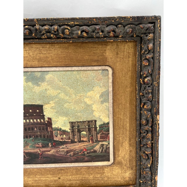 A single antique print of a Roman landscape featuring the coliseum. Finished with double mat and a gilt carved wood frame.