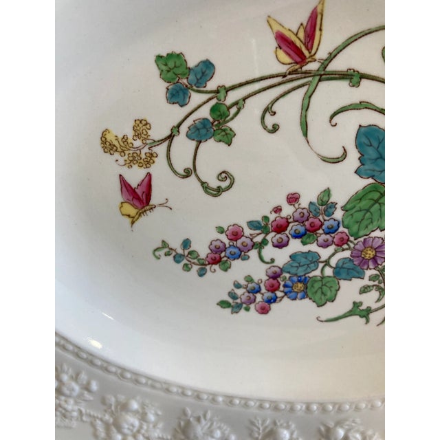 Elegant and timeless, this Wedgwood oval serving platter showcases a delicate hand-painted floral bouquet with butterflies...