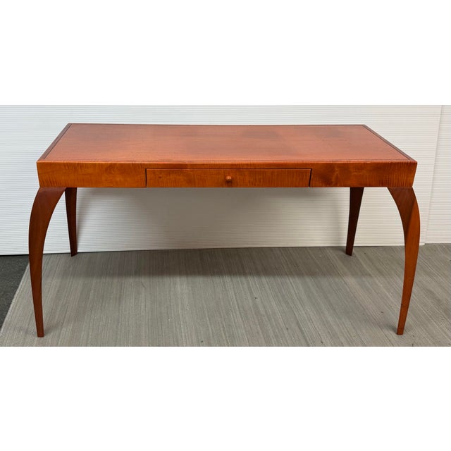 Design Plus Gallery presents a Cherry Wood Stain Writing Desk. This desk is likely from the late 20th century and has a...