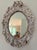 Naturalistic vintage seashell mirror featuring tiny clam shells, oysters, and slippers snail shells hand set in plaster....