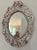 Naturalistic vintage seashell mirror featuring tiny clam shells, oysters, and slippers snail shells hand set in plaster....