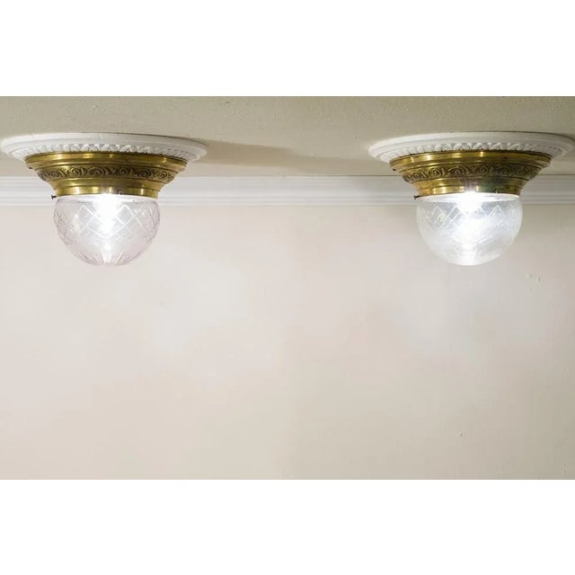 Ancient pair of suspension lamps Art Nouveau (Liberty) dating back to about 1910. These elegant ceiling lights have the...