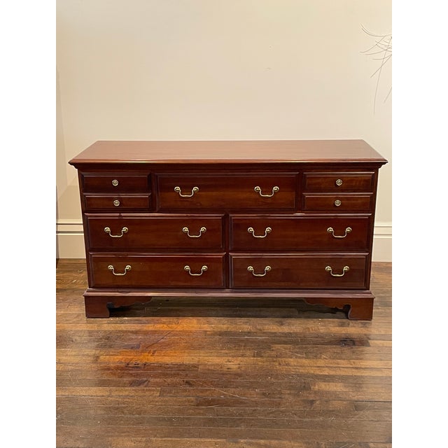 Pennsylvania House solid Cherry Chippendale dresser with matching Mirror from the early 1990s. Seven drawers are in...