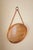 1960s Pine Wall Mirror by Nils Troed for Glasmäster, Sweden. Beautiful round pine frame with a leather trim running...