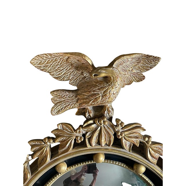 A vintage, federal style convex wall mirror in very nice condition. The frame is constructed from molded wood and applied...