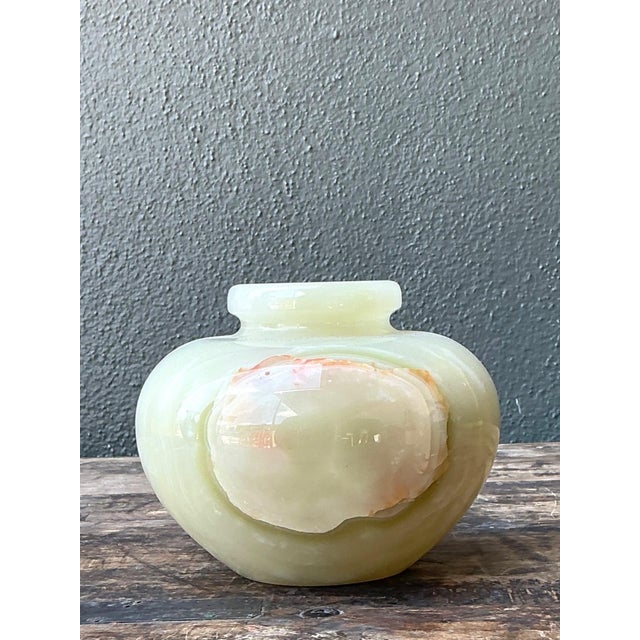 This elegant vintage stone onyx vase highlights the timeless beauty of natural materials through its refined form and...