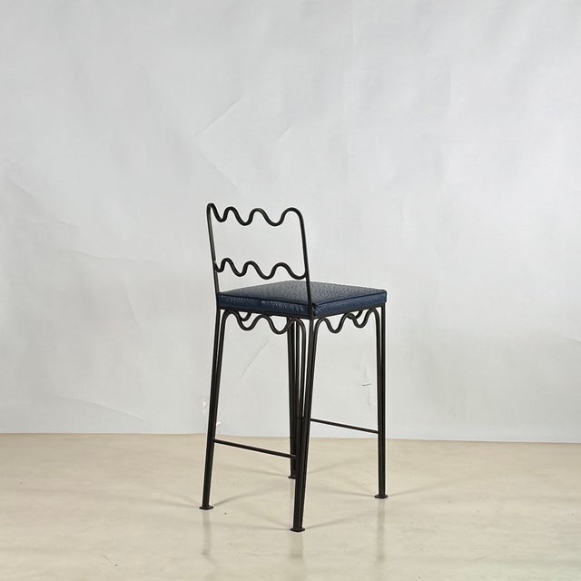 The Méandre™ counter stool by DESIGN FRÈRES®. Upholstered firm but comfortable. Shown here with custom leather upholstery.