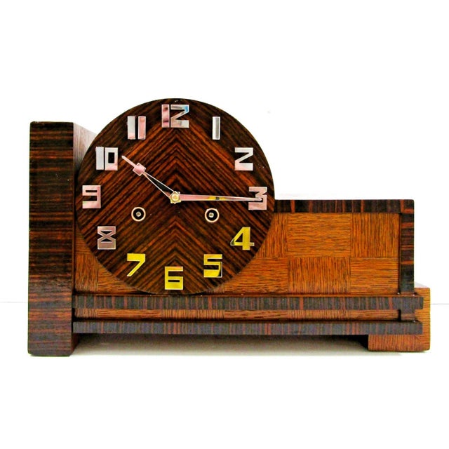 The antique 1931 German Junghans Pfeilkreuz Coremandel mantel clock is a unique and stylish piece of decor that embodies...