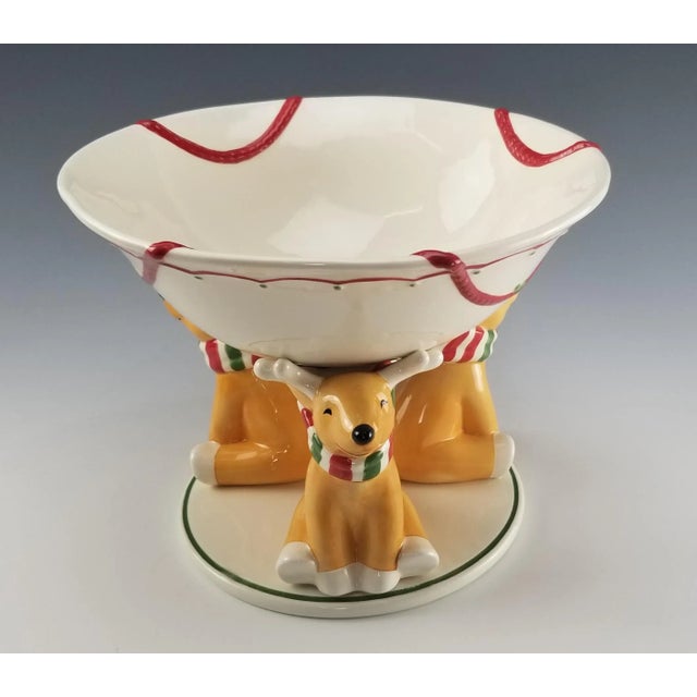 The Lenox Festive Reindeer cookie bowl. Is a delightful combination of whimsy and classic design. 3 little deer hold up...