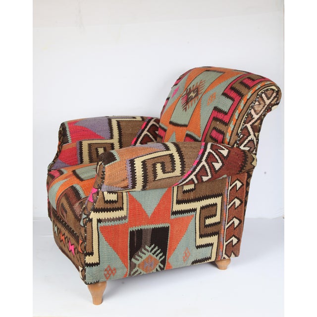 A beautiful one of a kind handmade Ottoman armchair upholstery with vintage handwoven Kars Kilim, it is in wooden...
