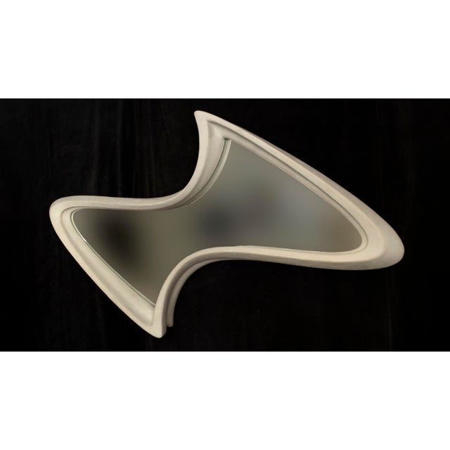 Mirror No. 5 is a large-scale wall-mounted mirror object designed by Chris Delmar. Its broad horizontal form combines a...