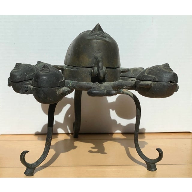 Vintage Hindu deity bronze Incense burner with multiple compartments. Faces are of various sizes to hold incense.