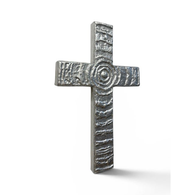 A one-of-a-kind handcrafted wall sculpture featuring a richly textured silver finish and a contemporary interpretation of...
