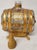 Am an unusual Bohemian glass and gold gilt metal decanter. Shaped like a barrel. Measures 9” tall, 6” wide and 3 1/2”...