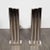 Handmade by our bespoke atelier in New York, this stunning and graphic skyscraper style pair of tubular andirons embodies...