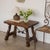 Beautiful 19th century wood and iron trestle table from Spain. Rectangular top, four carved wood legs, and beautiful...
