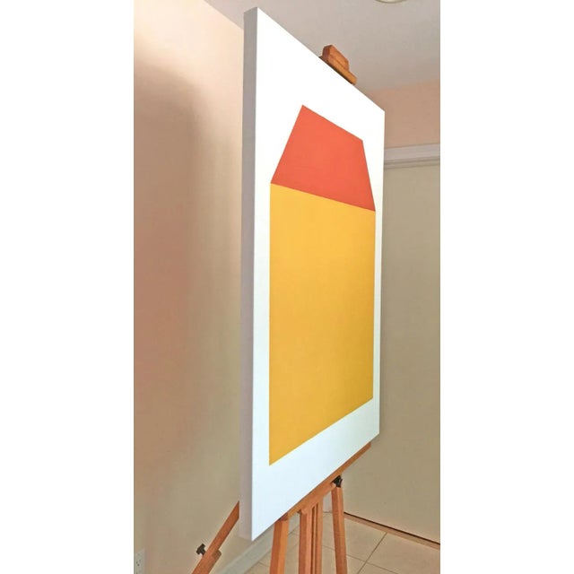 Façade presents an orderly display of a well-proportioned, symmetrical house. This stable outward appearance is portrayed...